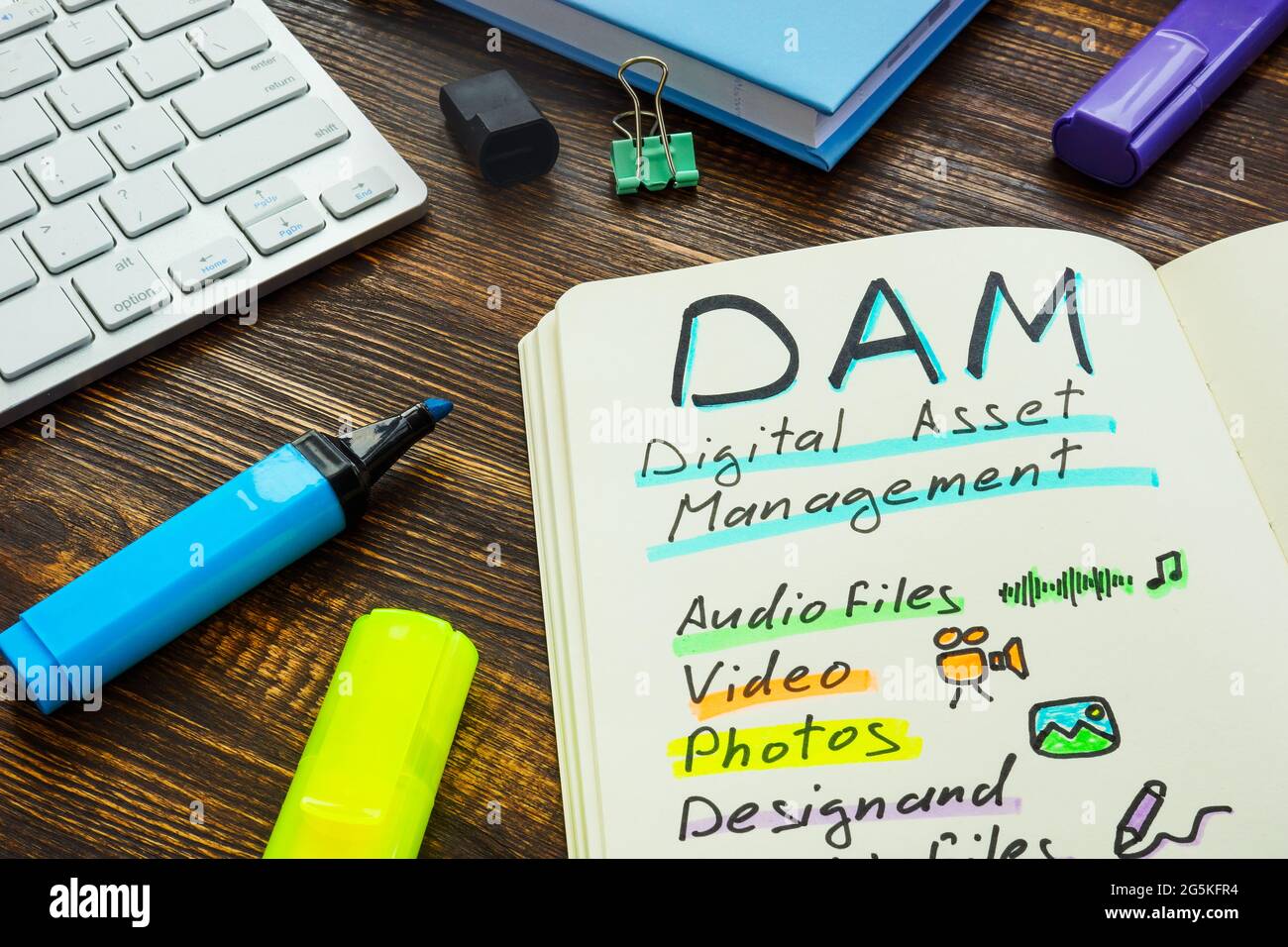Marks about DAM digital asset management in the note. Stock Photo