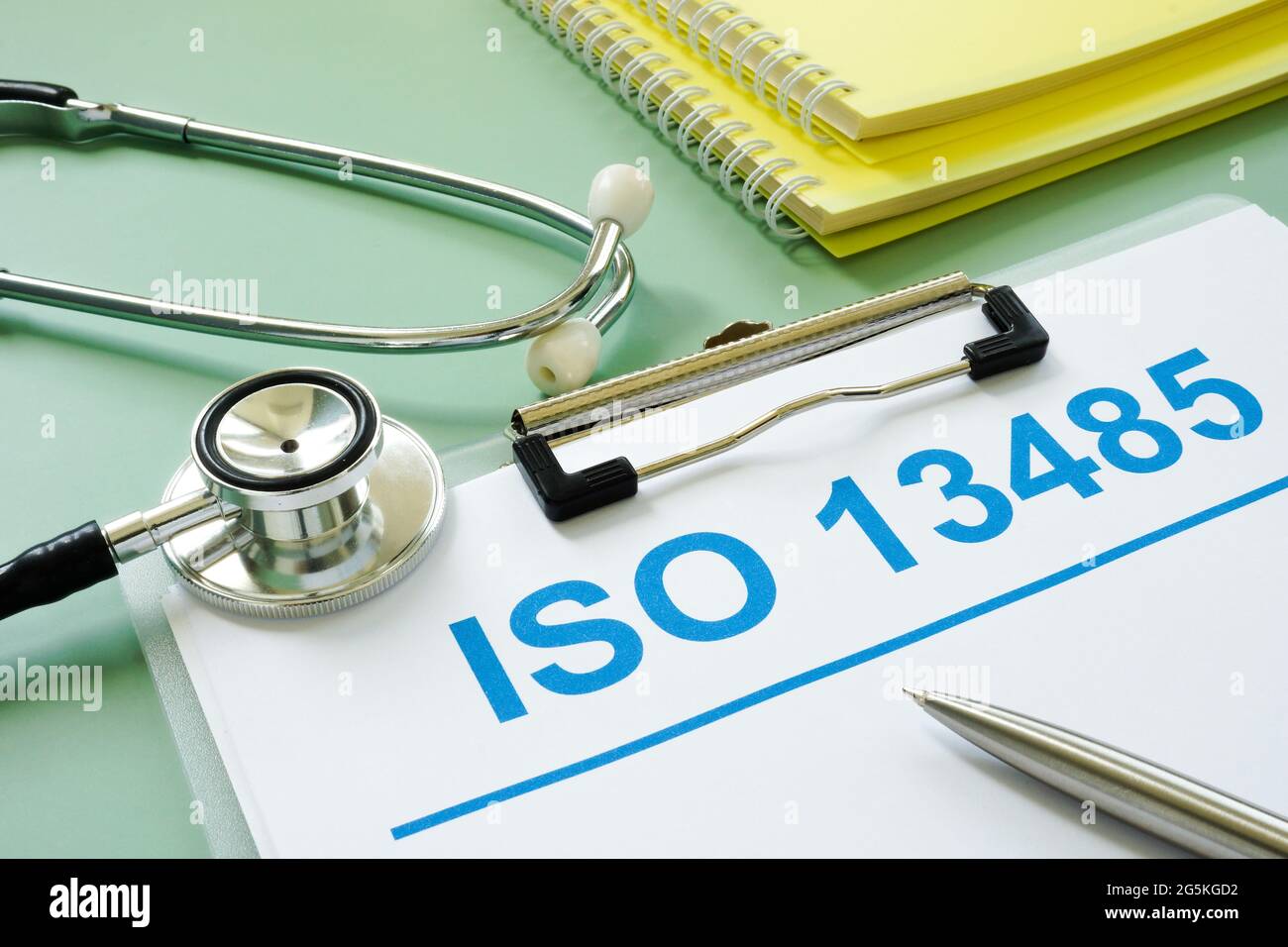 ISO 13458 documents and medical stethoscope with pen. Stock Photo