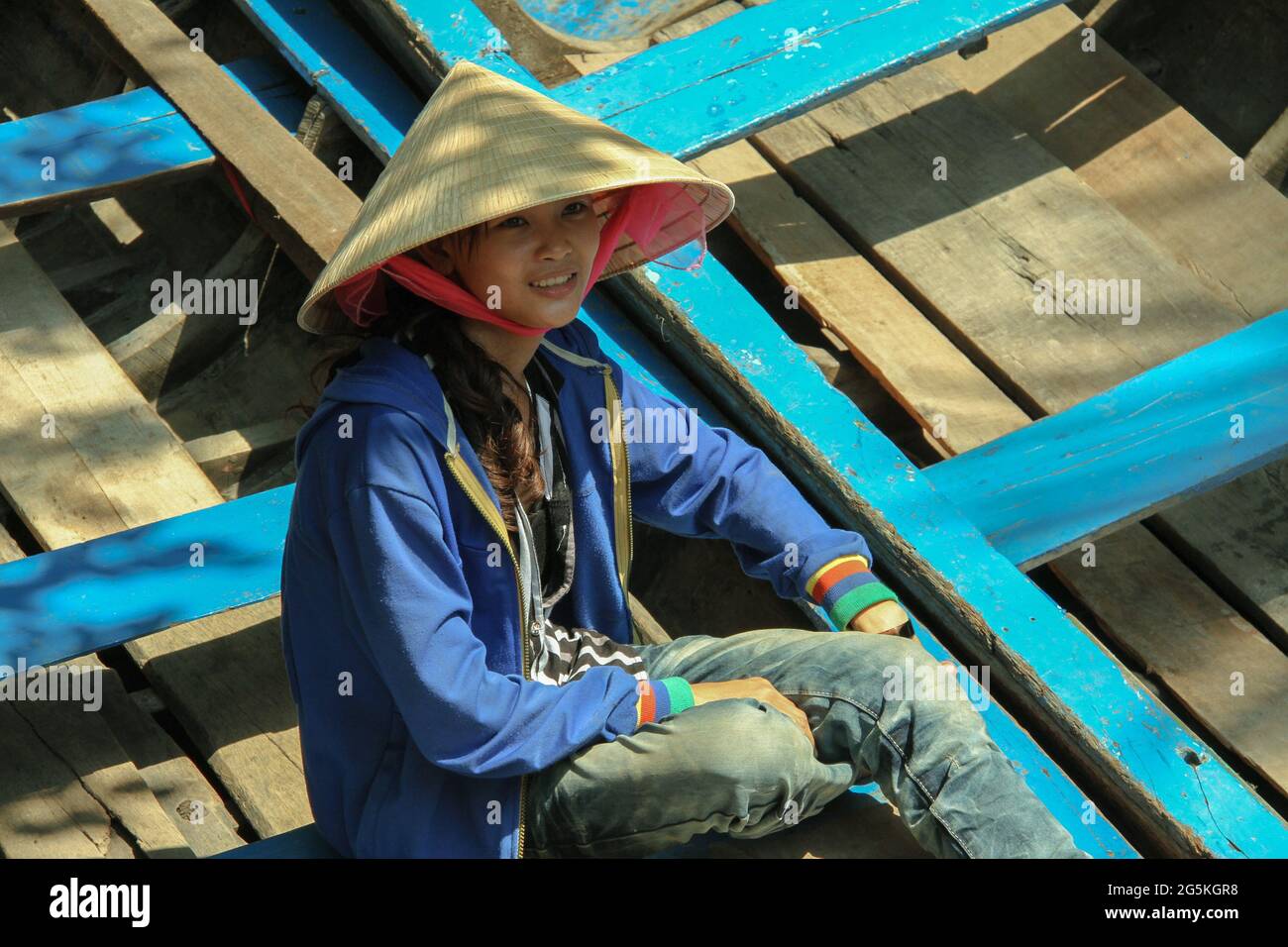 Female rower on Sampan, on Mekong Delta, Vietnam Stock Photo