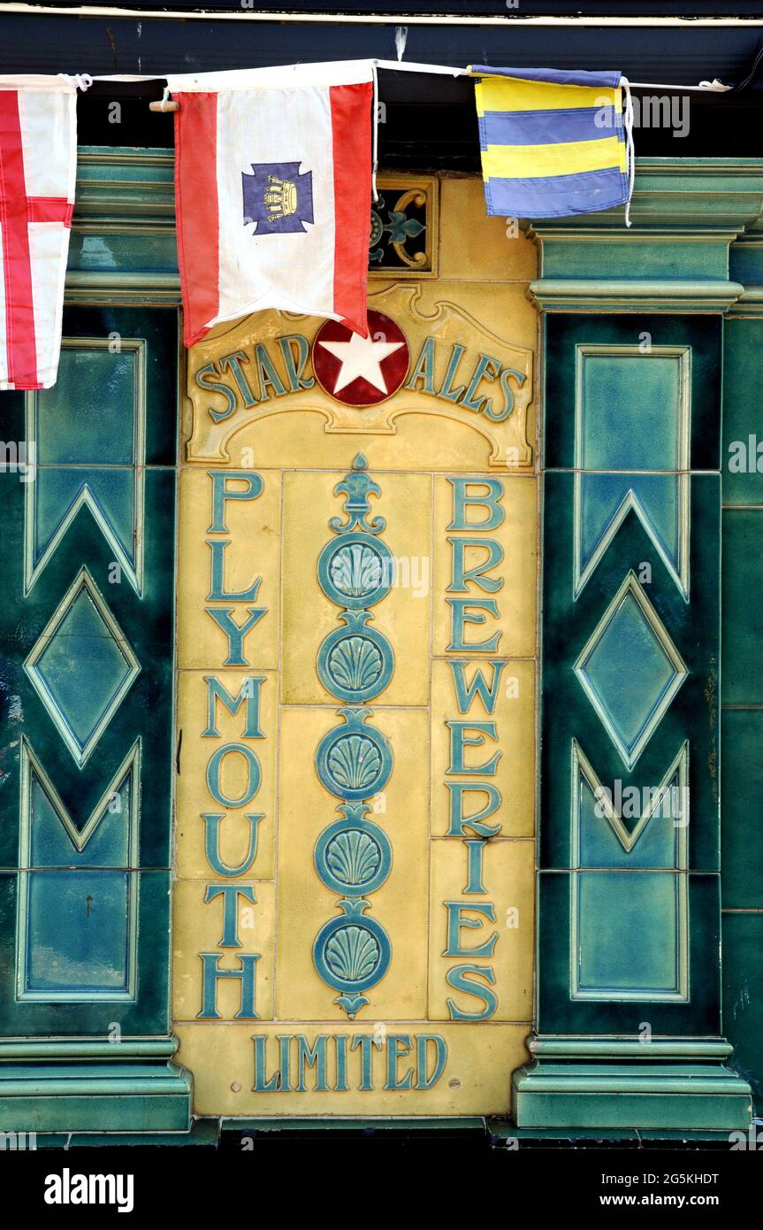 Old ceramic tiles from The Plymouth Breweries, advertising their Star ale, on the outside wall of The Dolphin Inn in the Devon town of Dartmouth. Stock Photo