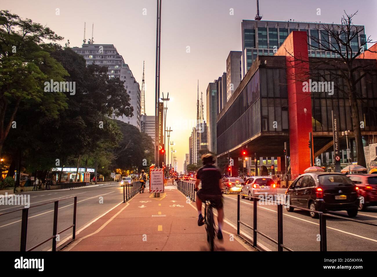 Man riding a bicycle on the Paulista Avenue bike path Stock Photo