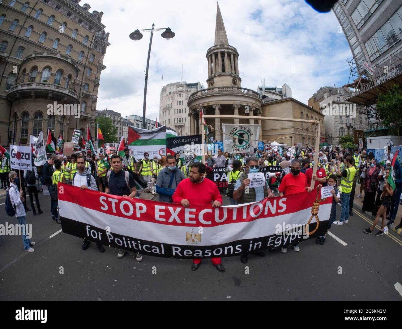 London protests, Activists protest in Central London at the People's Assembly National Demonstration, protesters demonstrate the rising number of executions in Egypt with banner reading stop executions for political reasons in Egypt Stock Photo