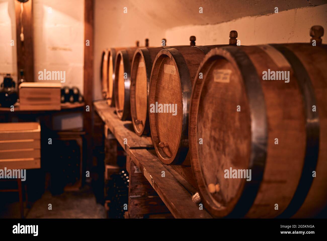 Wooden barrels with wine in storage room Stock Photo Alamy