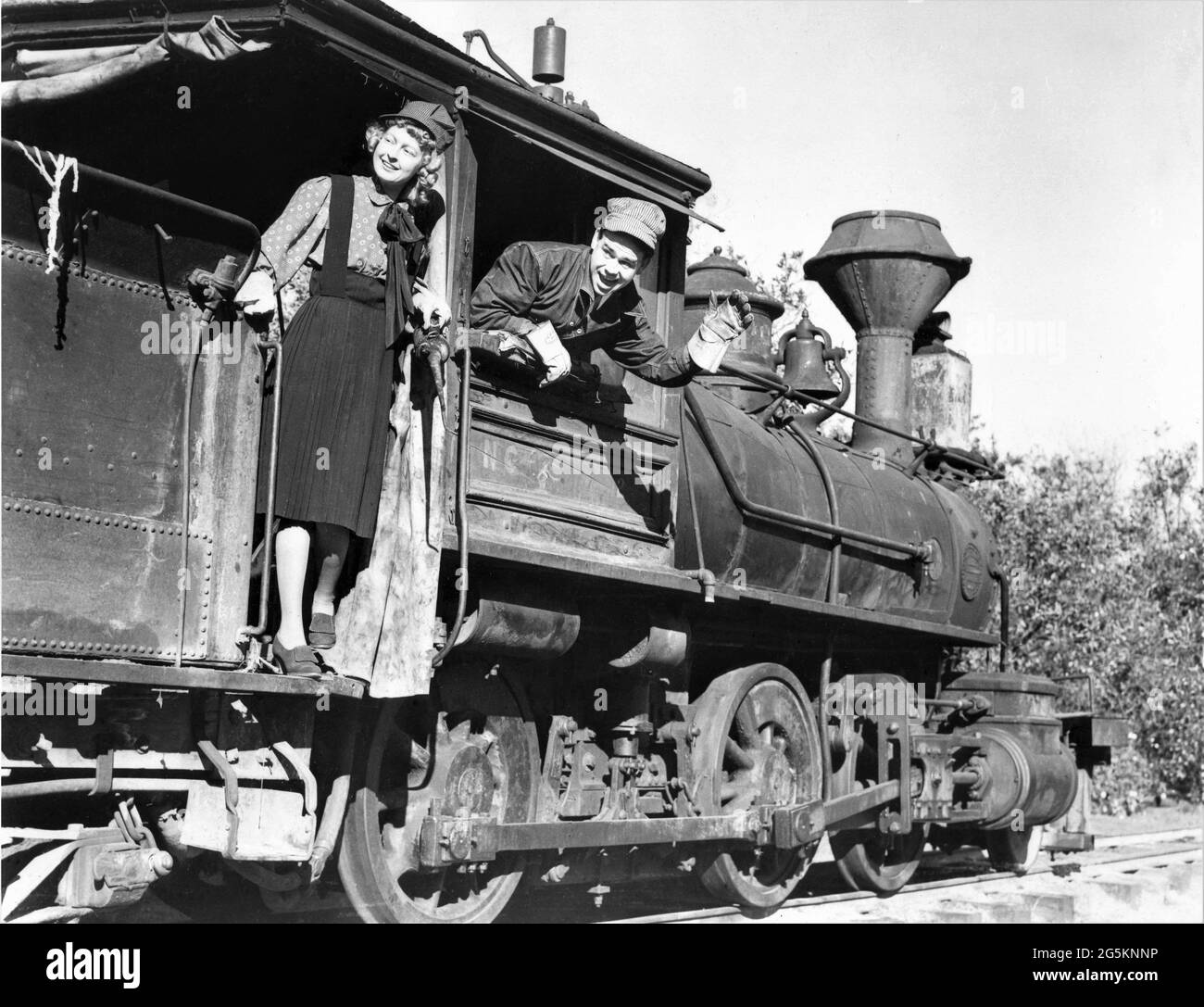 Walt Disney Animator WARD KIMBALL and his wife BETTY in early 1939 riding their private Antique 58 Year Old Steam Locomotive Train on their Private Railroad in San Gabriel California Stock Photo