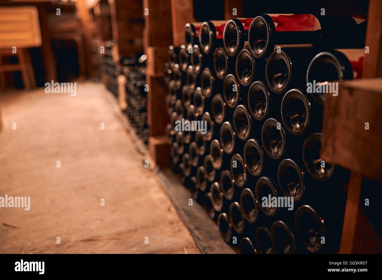 Bottles of wine stored in wine cellar Stock Photo Alamy