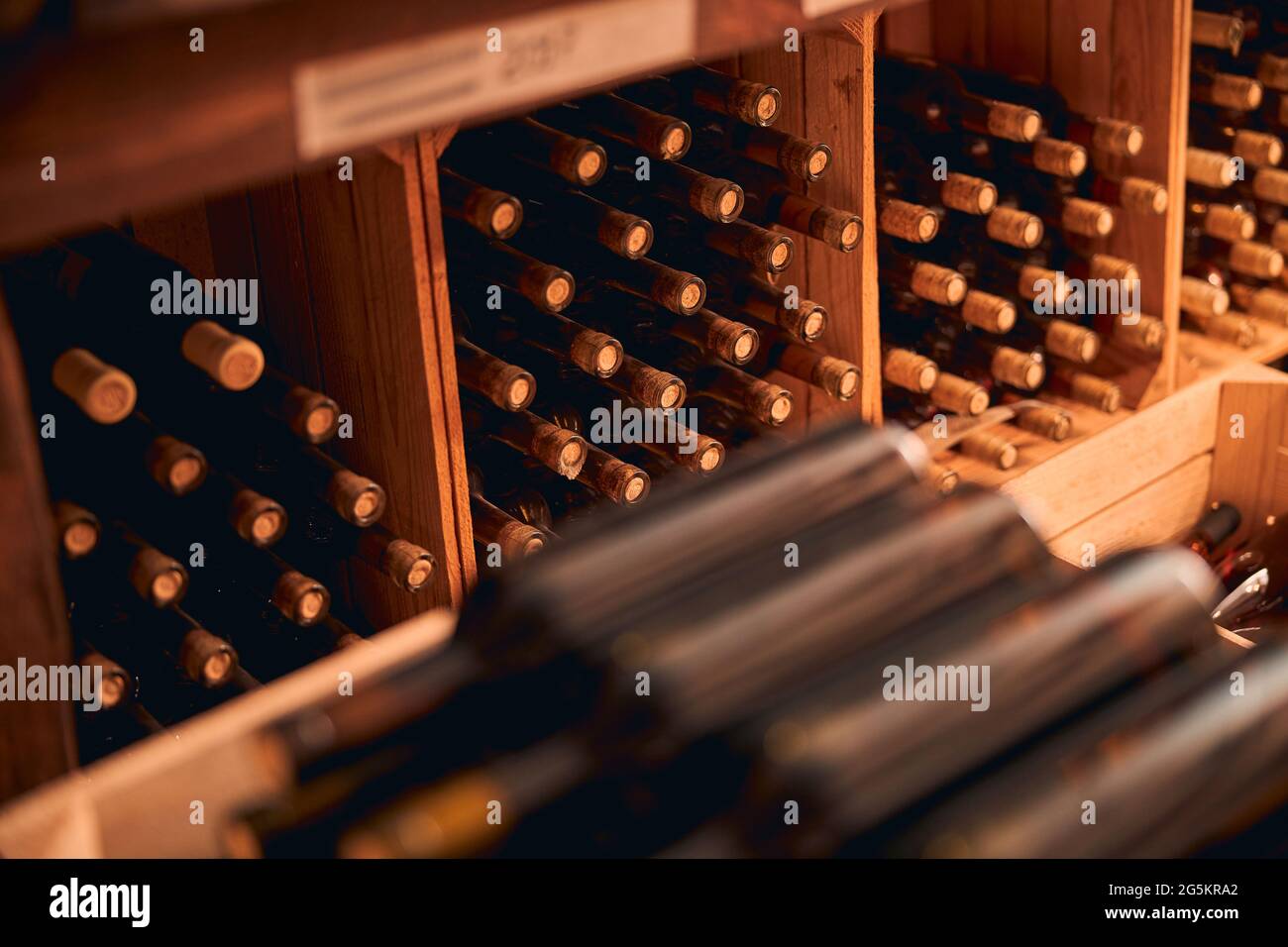 Bottles of wine with corks stored in wine cellar Stock Photo Alamy