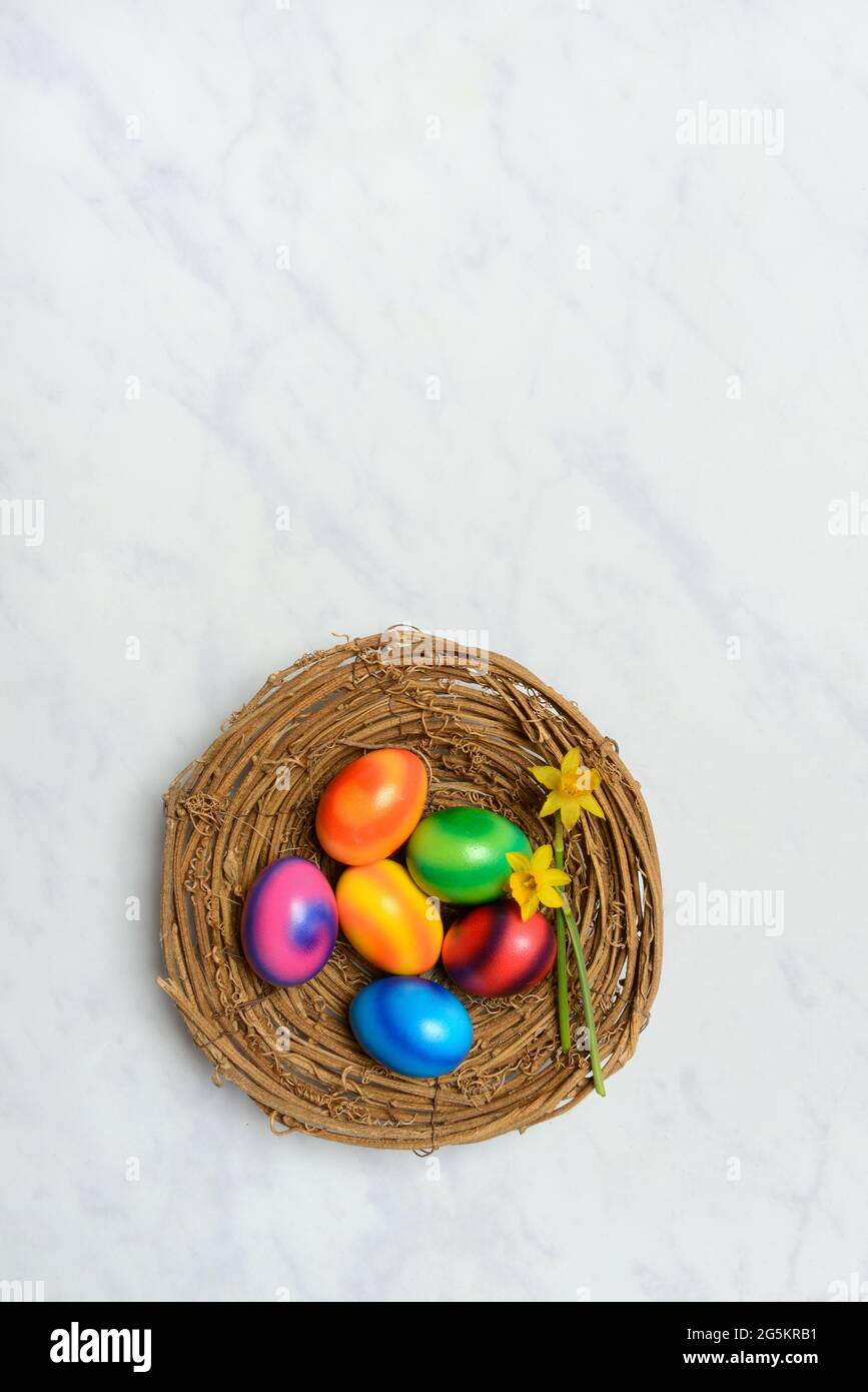 Colourful Easter eggs in Easter nest Stock Photo