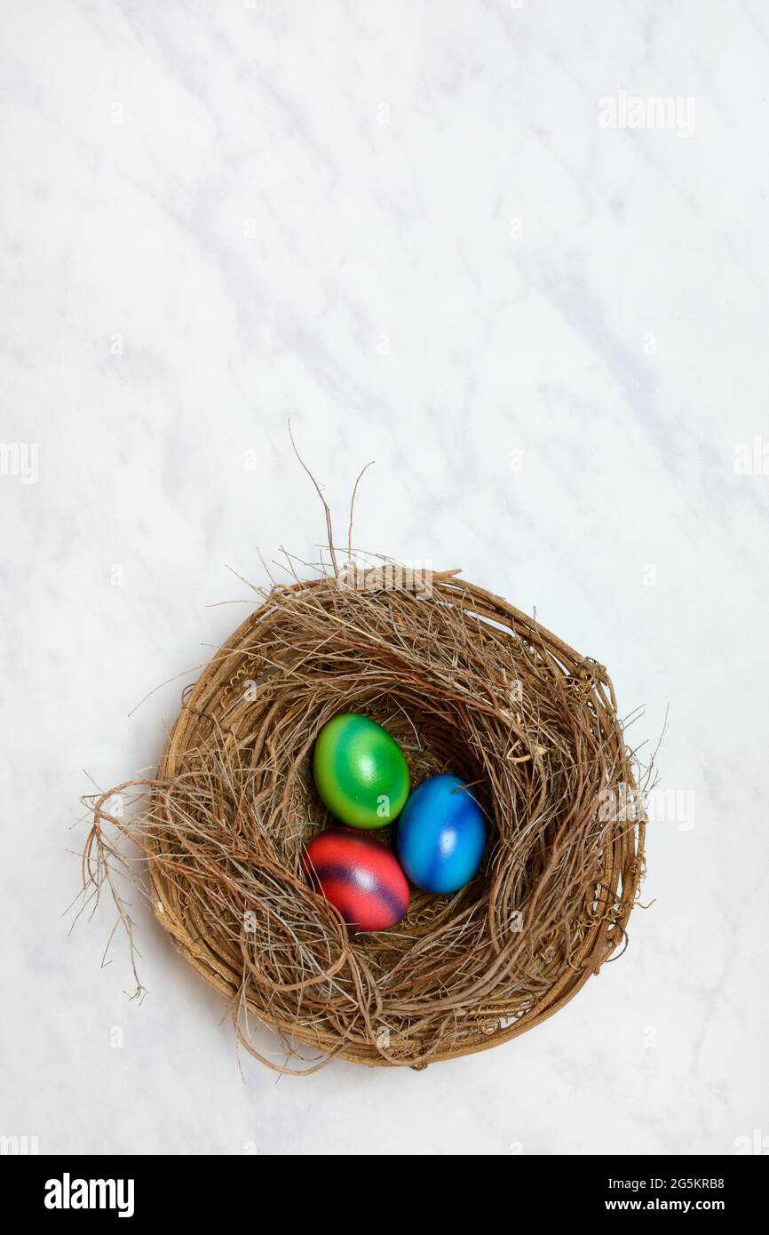 Colourful Easter eggs in Easter nest Stock Photo