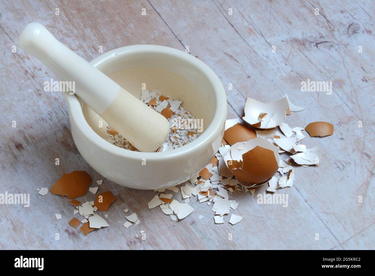Broken eggshells crushed with mortar Stock Photo Alamy