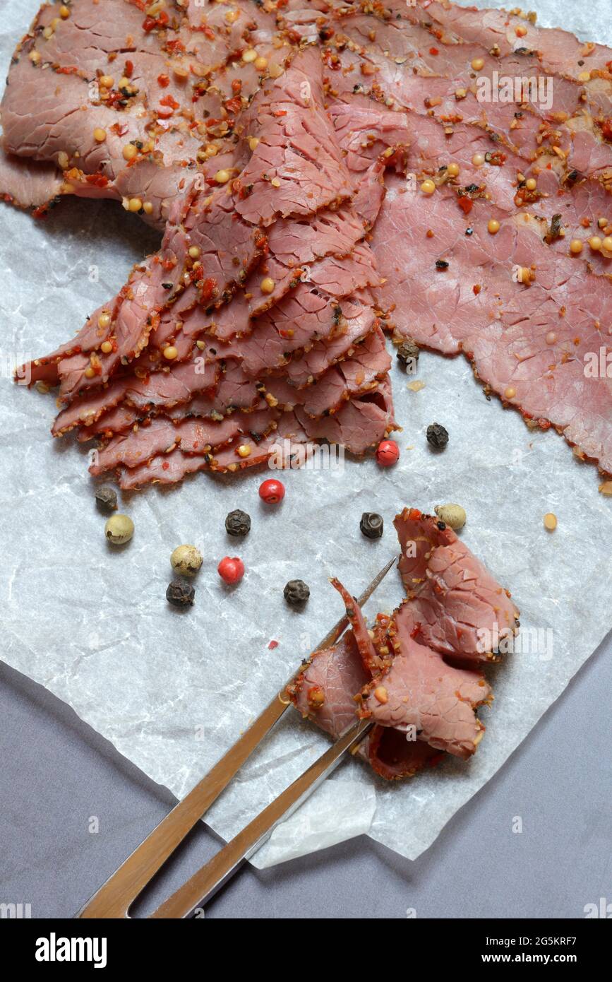 Pastrami, seasoned beef with fork Stock Photo