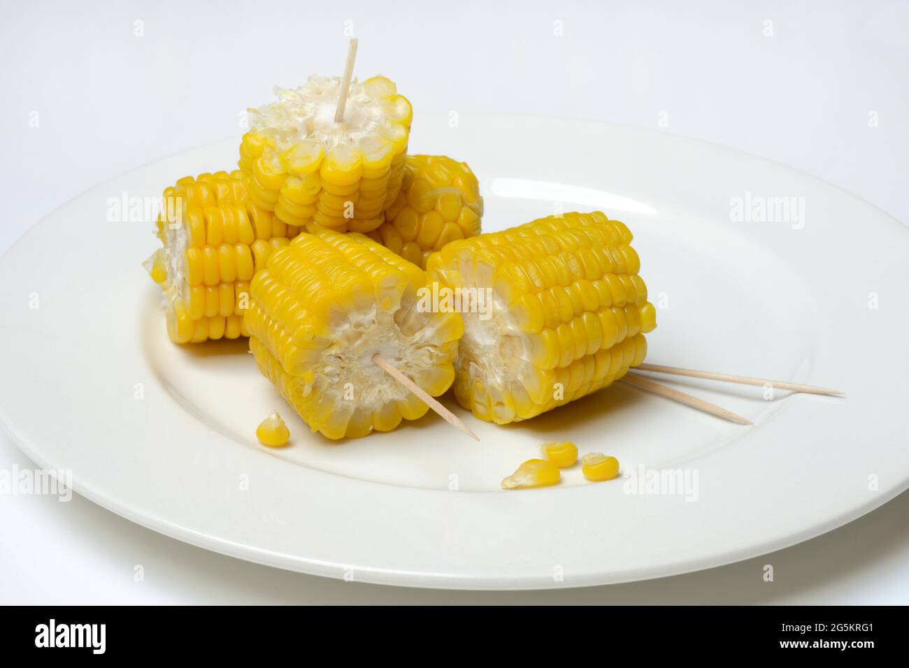 Cooked corn cobs, cut up, on plate, Germany, Europe Stock Photo