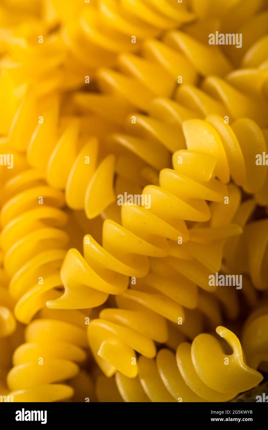 Dry Yellow Organic Rotini Pasta in a Bowl Stock Photo Alamy