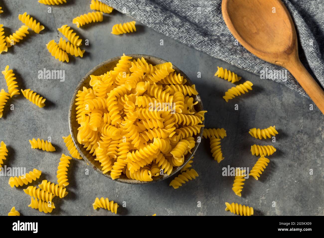 Dry Yellow Organic Rotini Pasta in a Bowl Stock Photo Alamy