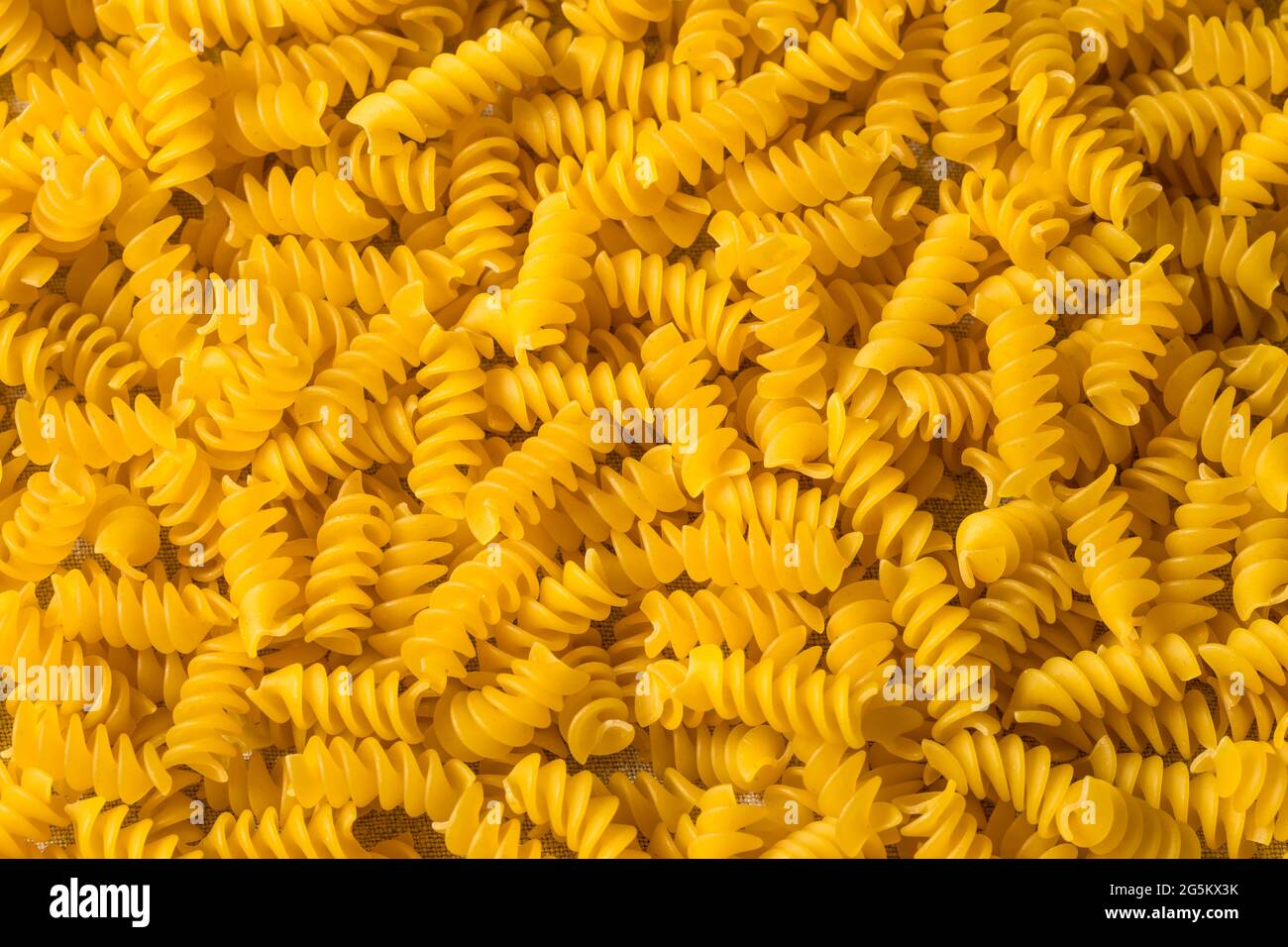 Dry Yellow Organic Rotini Pasta in a Bowl Stock Photo Alamy
