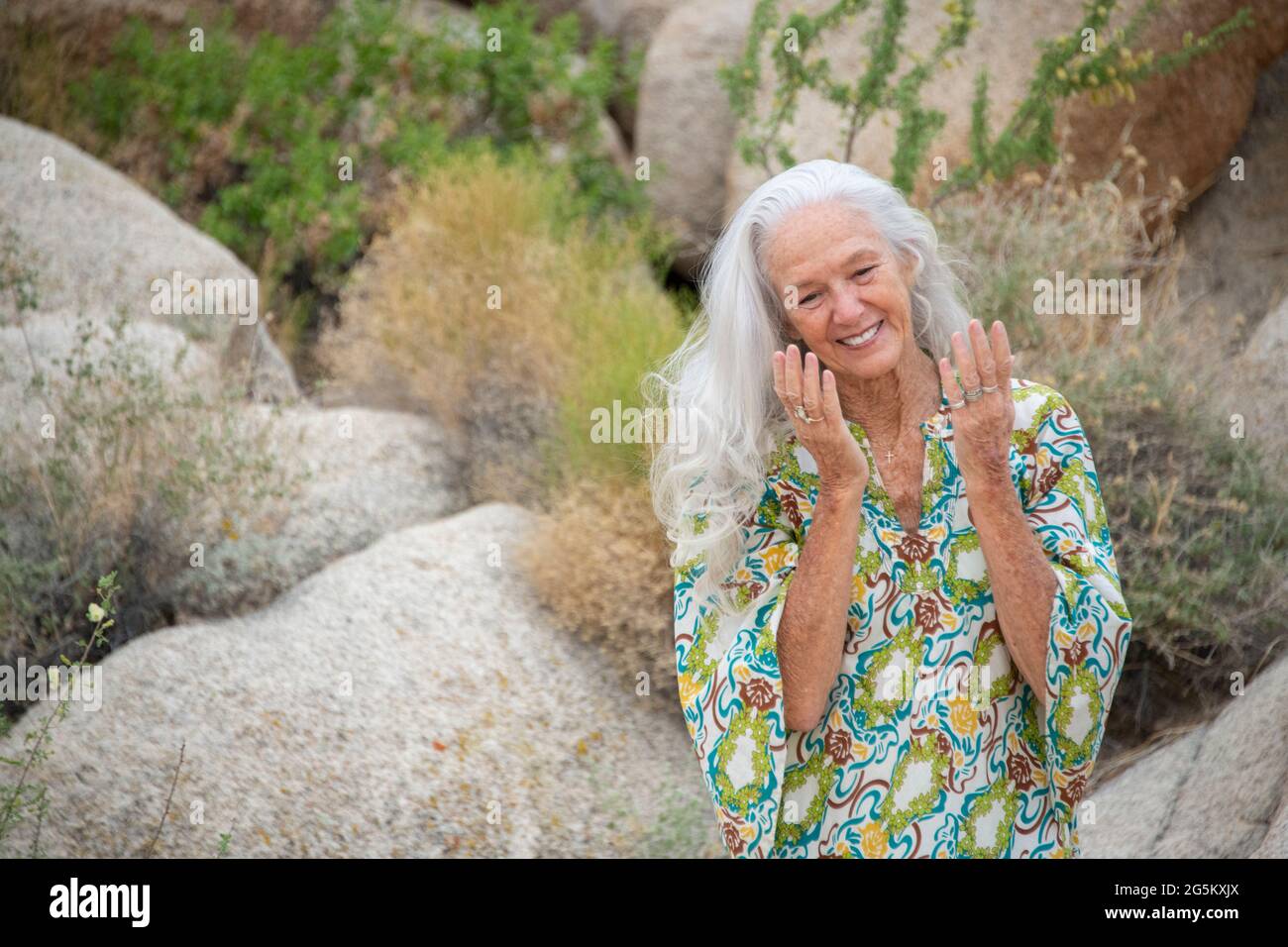 Senior woman desert location. Stock Photo