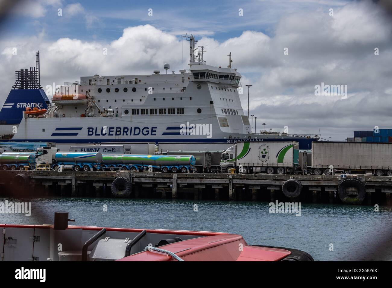 Commercial vehicles loading onto interisland ferry Stock Photo