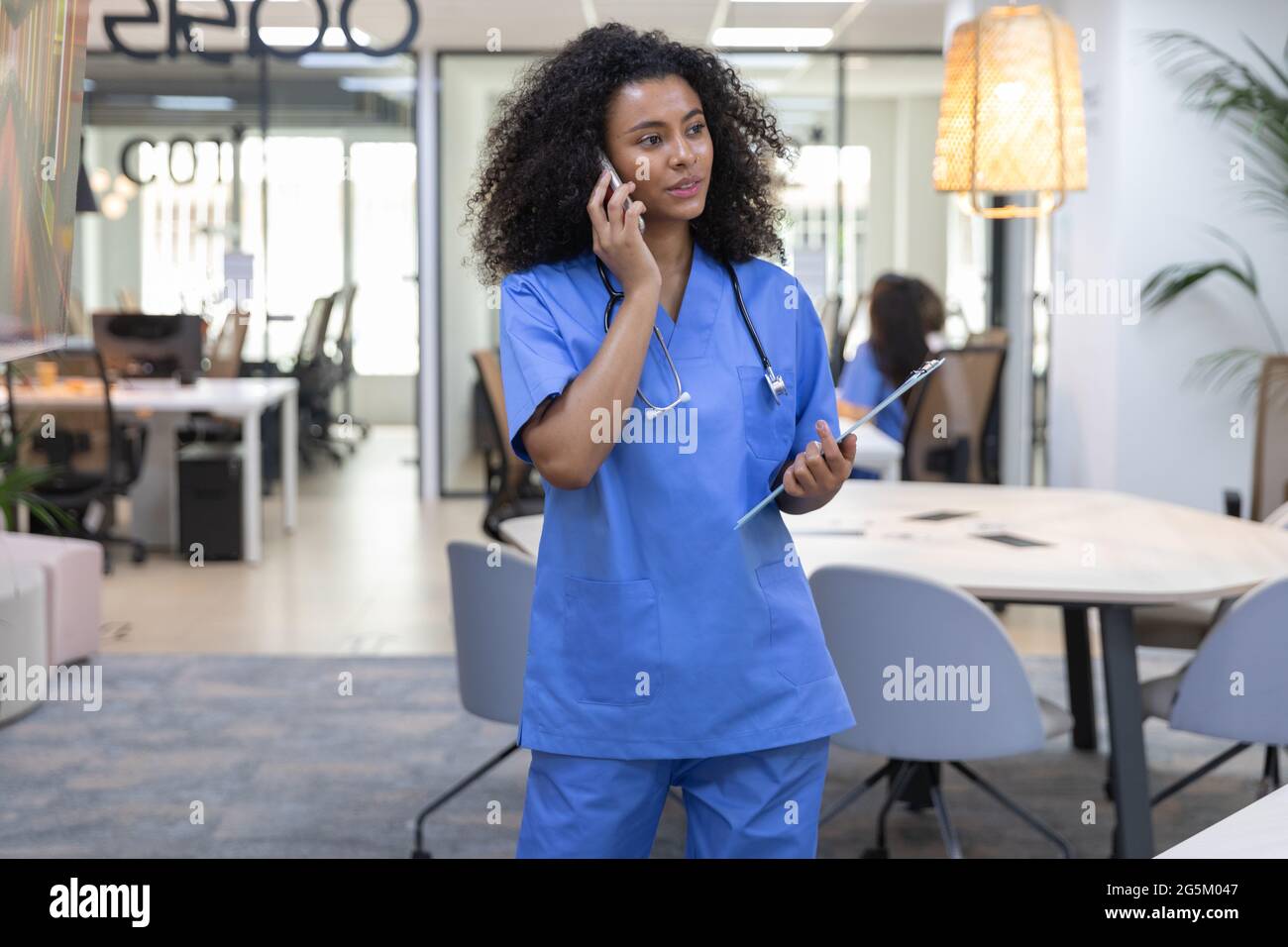 Nurse wearing blue uniform hi-res stock photography and images - Alamy
