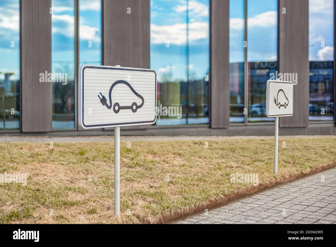 Parking space for an electric car. Parking sign. Incentives for