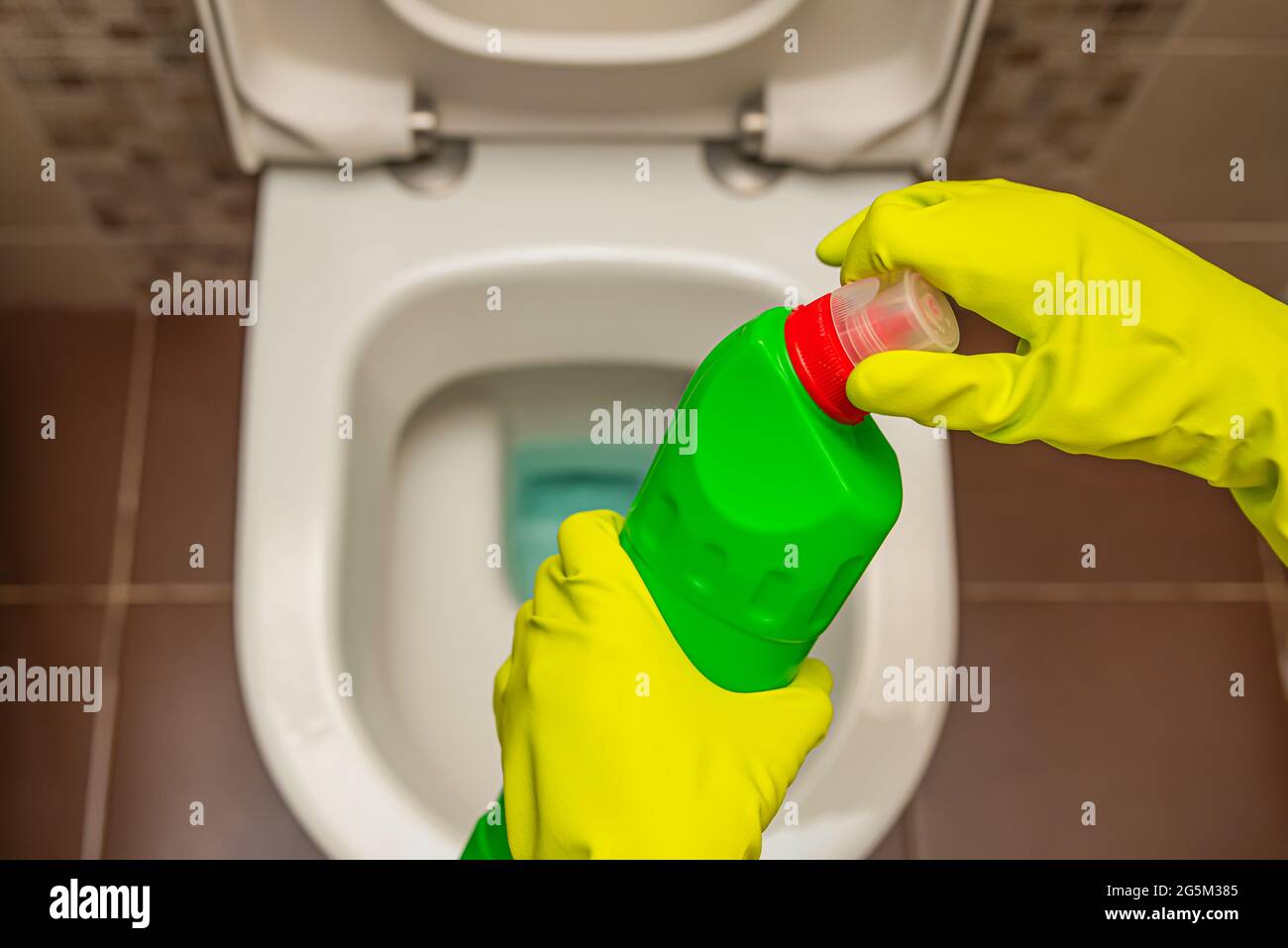 Cleaning and disinfection of toilets. Open the toilet cleaner before