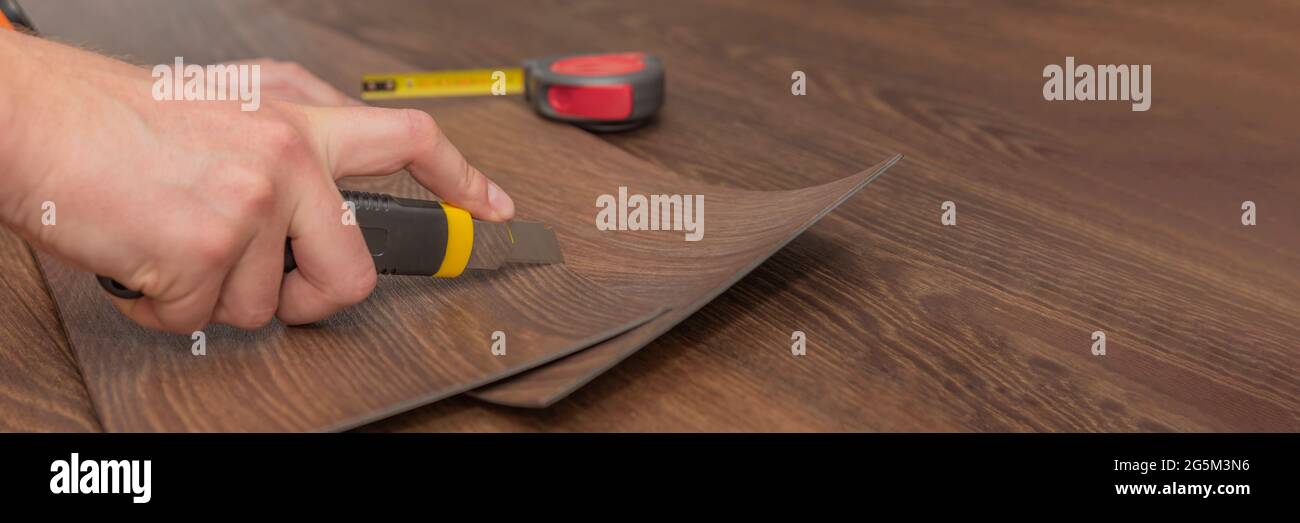 Vinyl flooring installation. Easy installation and cutting with a knife