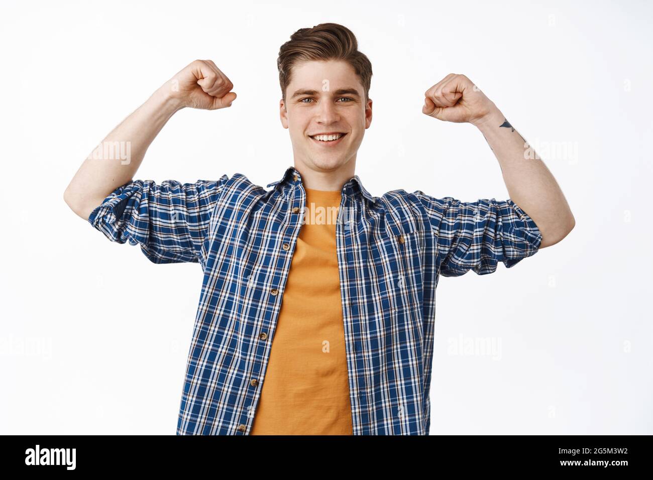 Super happy young man chanting, celebrating victory, raising hands in ...