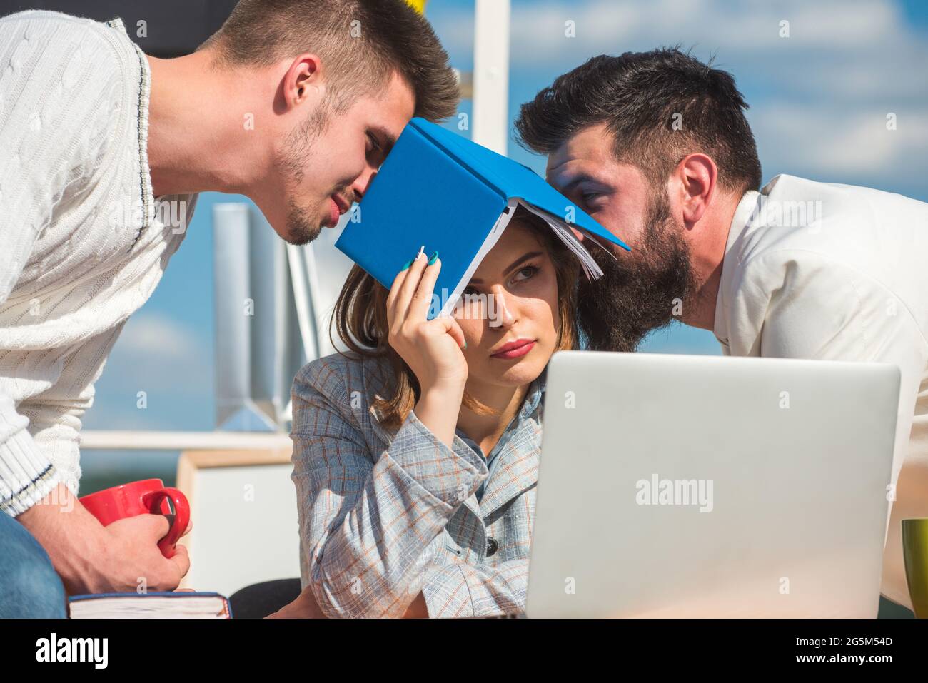 Boring meeting. Office workers talking. Sad secretary, assistant and manager. Business team discuss at the outdoor Stock Photo