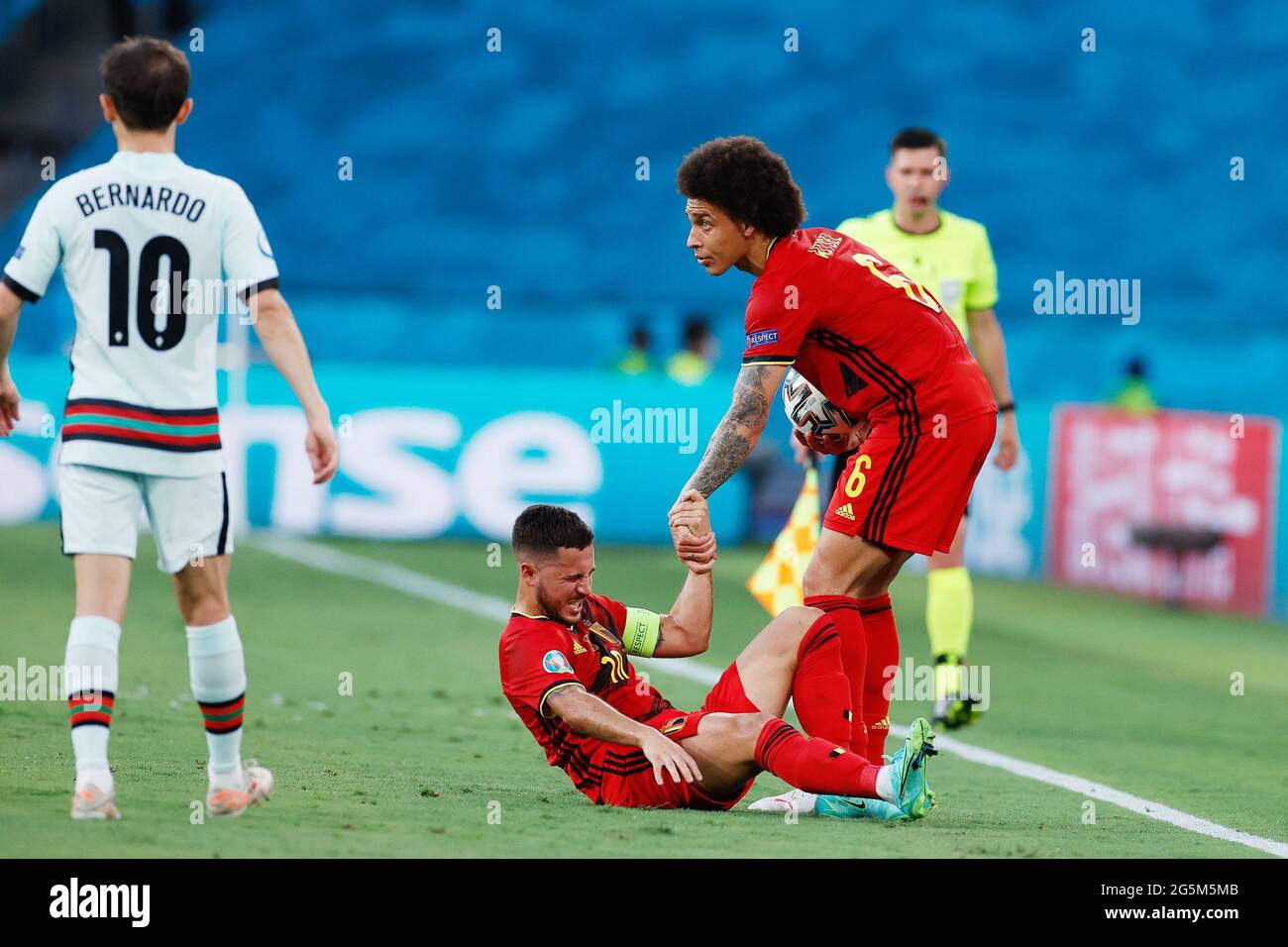 Axel Witsel of Belgium helps to Eden Hazard during the UEFA EURO 2020, Round of 16 football match between Belgium and Portugal on June 27, 2021 at La Cartuja stadium in Seville, Spain - Photo Joaquin Corchero / Spain DPPI / DPPI / LiveMedia Stock Photo