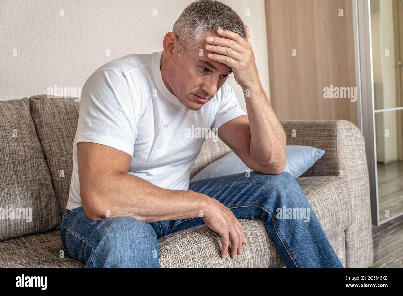 Depression, poor health. Apathetic state. A man with a detached look. The concept of a mental disorder Stock Photo
