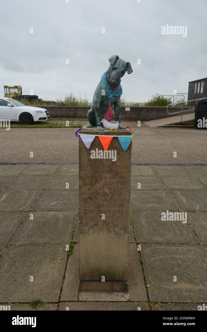 Dog statue in the centre of Aldeburgh history story metal green copper