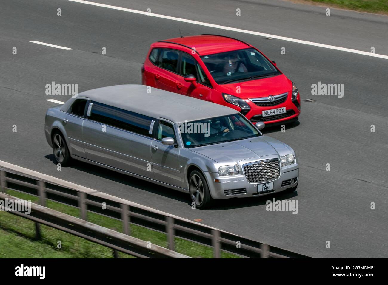 2007 Chrysler 300 C stretched limo, driving on the M6 motorway near Preston in Lancashire, UK. Stock Photo