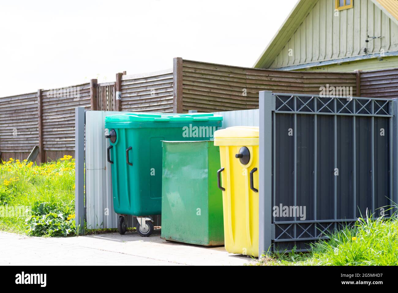 Plastic waste bins on the street near the house Stock Photo Alamy