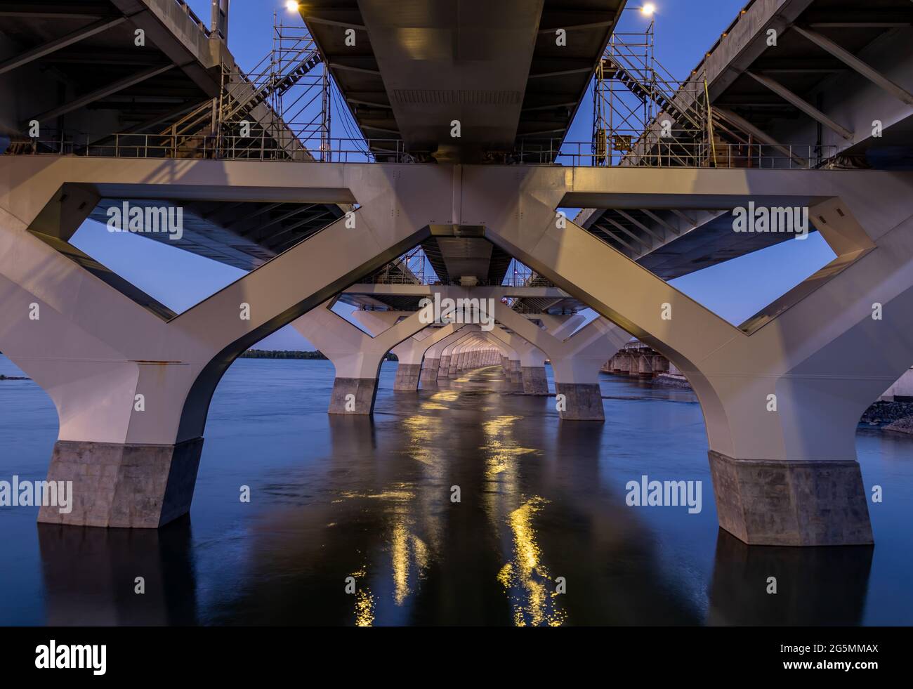 A view under the Champlain bridge in Montreal at sunset. Stock Photo