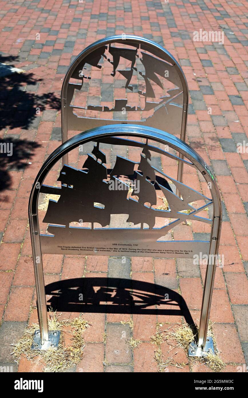 A metal bike rack with a negative and positive image of the USS Constitution. Stock Photo