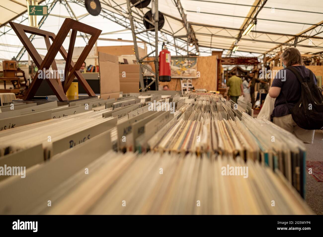 Selective focus at selected second hand old fashion phonograph discs in the paper box at the stall in flee market in Düsseldorf, Germany. Stock Photo