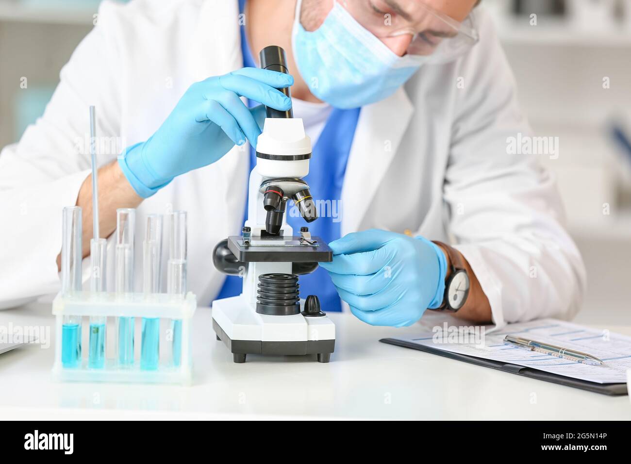Modern scientist sitting desk hi-res stock photography and images - Alamy