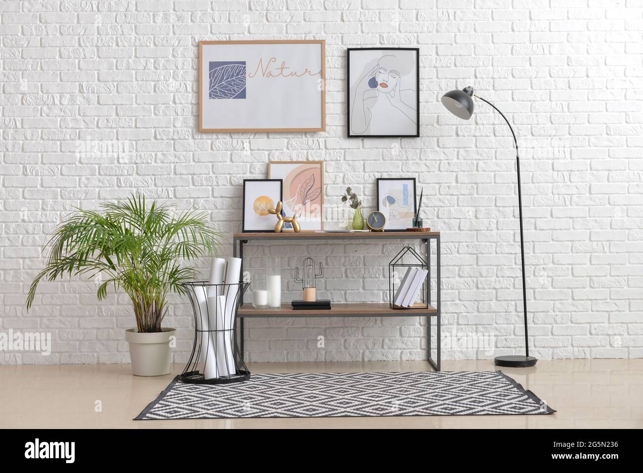 Interior of stylish living room with pictures Stock Photo - Alamy