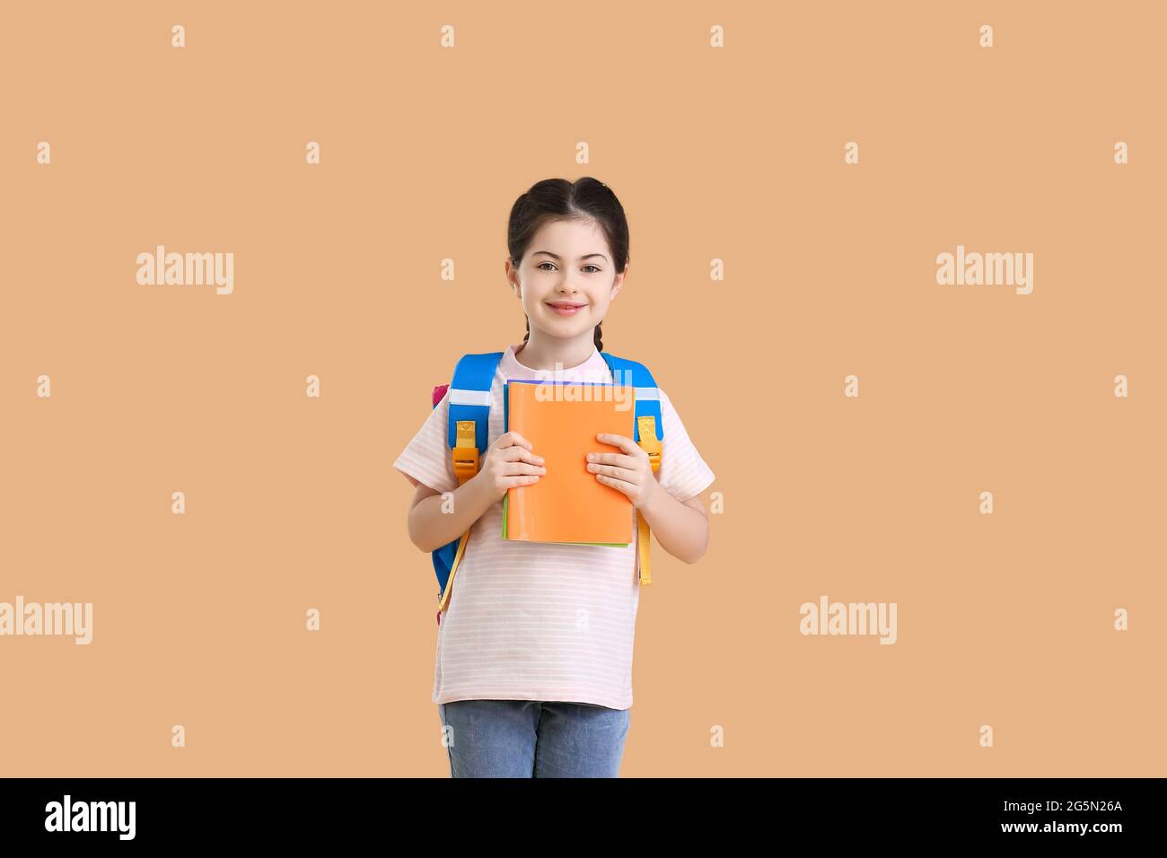 Little girl with backpack and notebooks on white background Stock Photo ...