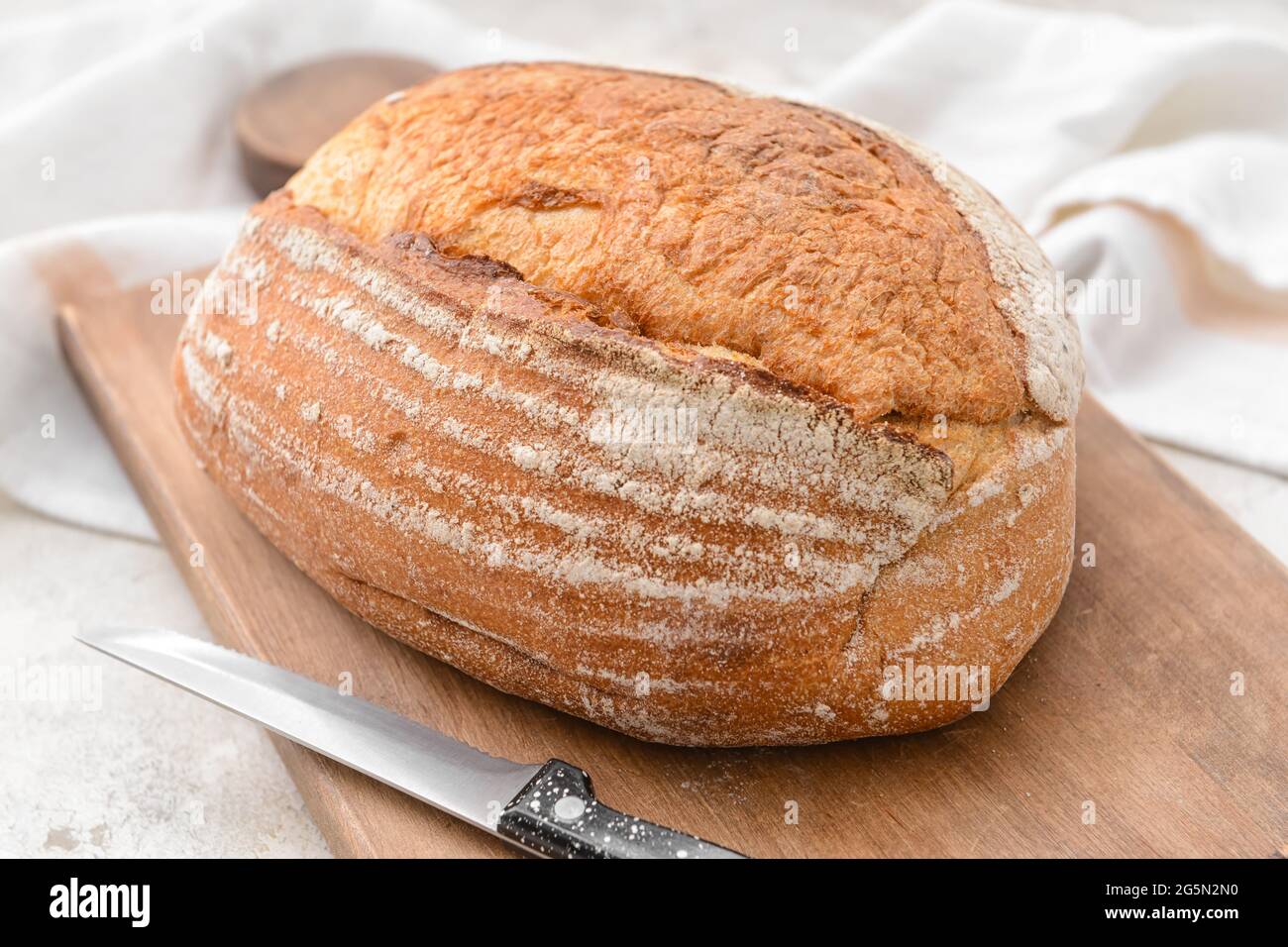 Loaf of sourdough bread on grunge background Stock Photo - Alamy
