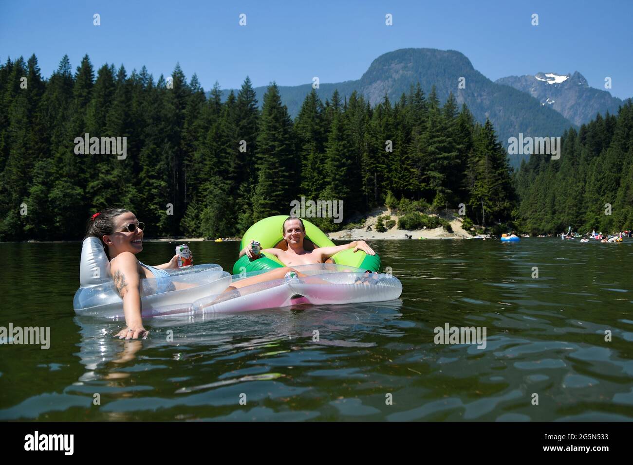 People headed to Alouette Lake to cool off during the scorching weather of a heatwave in Maple Ridge, British Columbia, Canada June 28, 2021. REUTERS/Jennifer Gauthier Stock Photo
