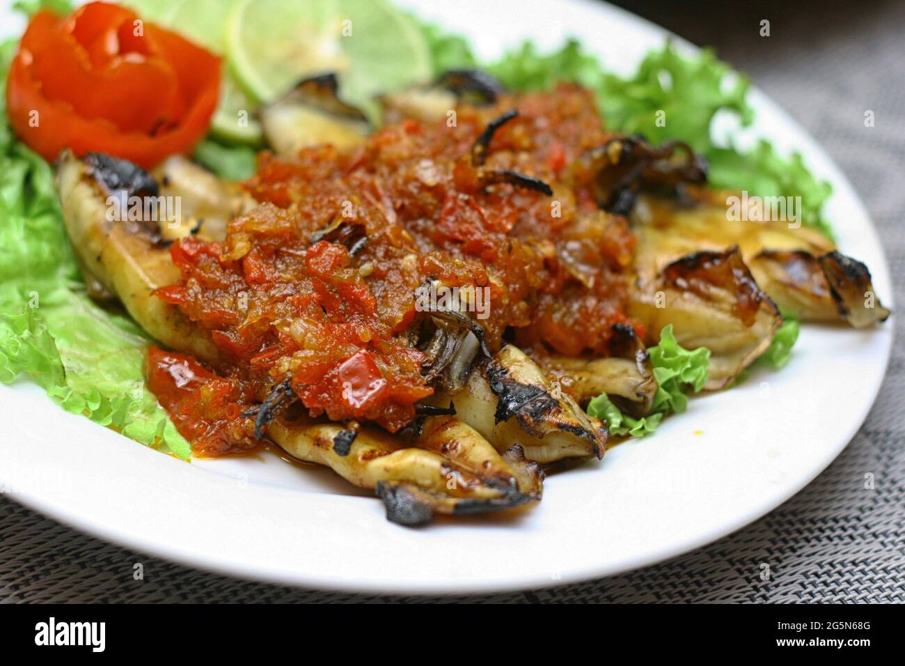 Delicious Salt and Pepper Grilled Squid with Red Chili Sauce, Lime, and