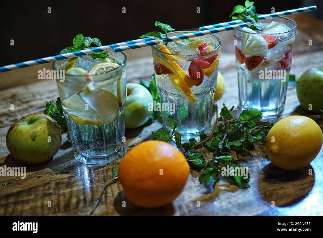 Gin tonic long drink as a classic cocktail in various forms with garnish in individual glasses Stock Photo