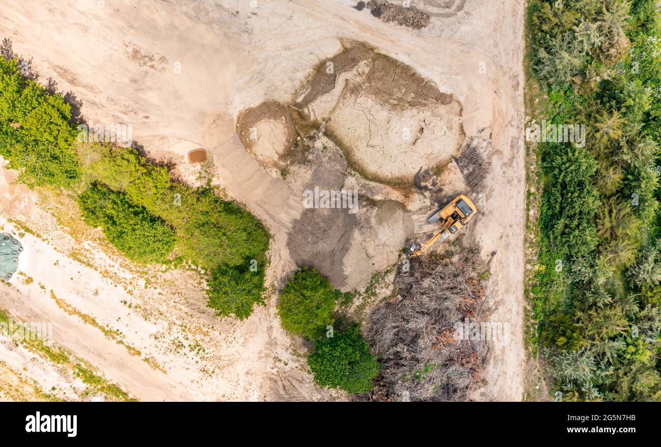 aerial view of an excavator in a landscape Stock Photo