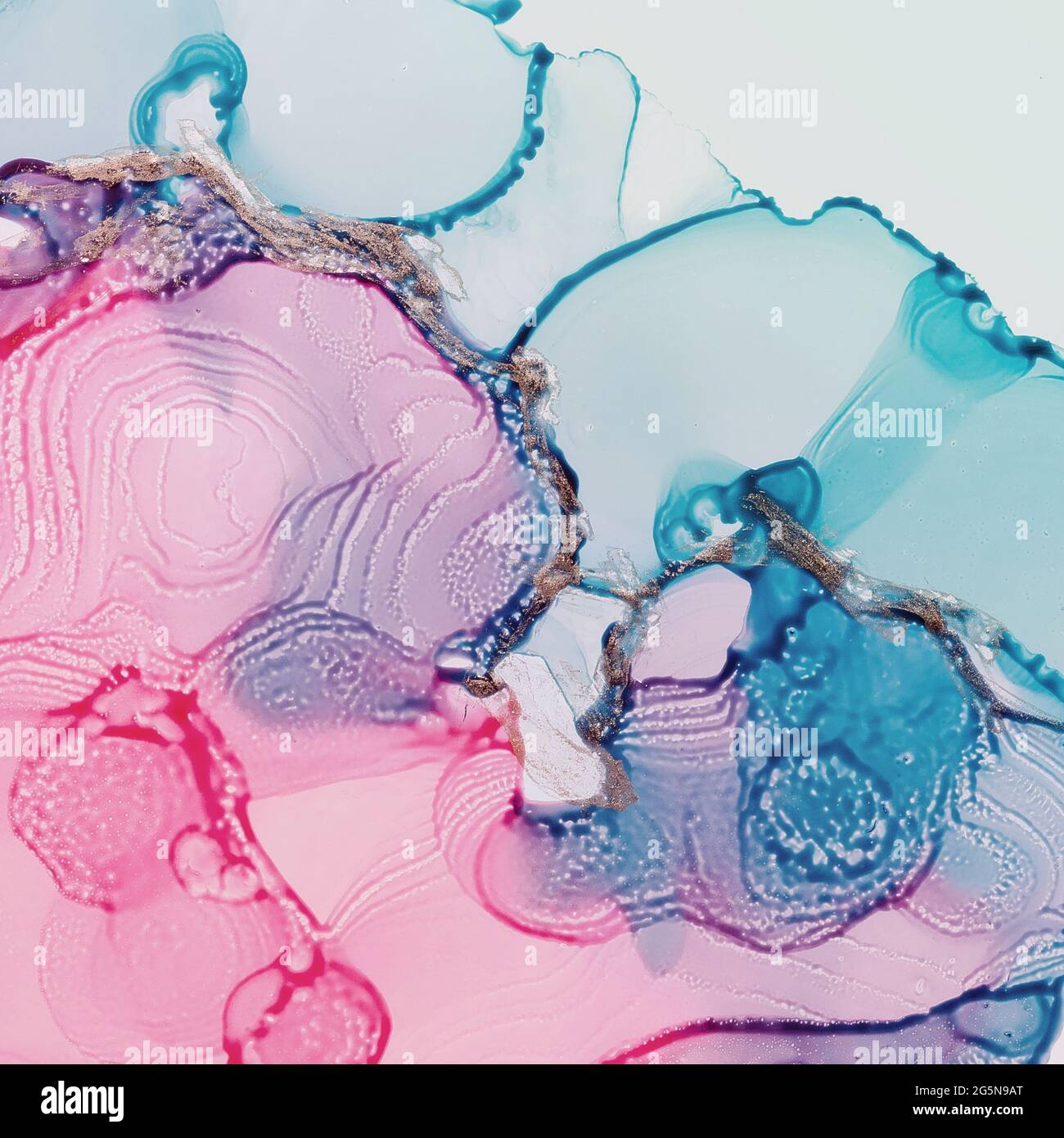 Alcohol ink fluid art. Waves in blue and pink colors with liquid golden