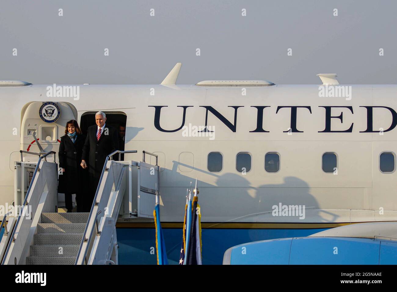 Feb 8, 2018-Songtan, South Korea-United States Vice President Mike Pence and Karen Pence arrives at Osan military air base in Songtan, South Korea.  Vice President Mike Pence is pushing South Korea to adopt a more hawkish stance toward the North, as he arrived in the country Thursday ahead of the Winter Olympics. Pence met with President Moon Jae-in to advocate a clear-eyed approach toward his bellicose, nuclear-armed neighbor, warning against North Korean 'propaganda' around the games. Athletes from both Koreas will compete as one team in the games opening Friday that senior officials from th Stock Photo