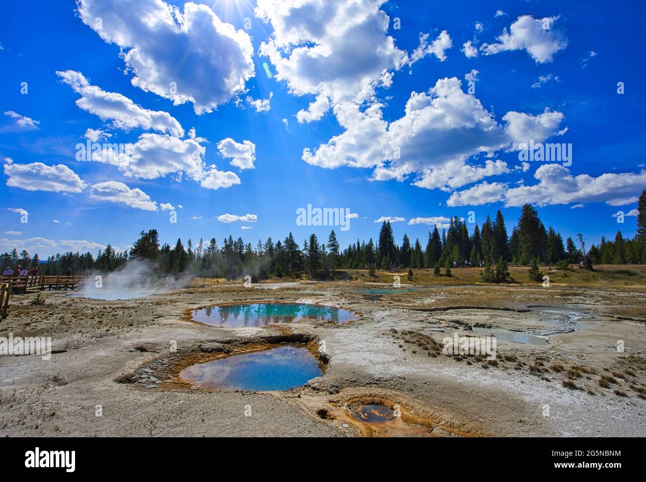 Mysterious and colorful Opal Pool. Yellowstone National Park is famous for its rich wildlife species and geothermal resources. Stock Photo