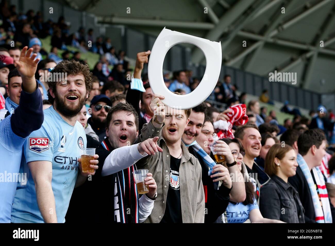 MELBOURNE, AUSTRALIA JUNE 27 Fans hold up toilet seats before the A