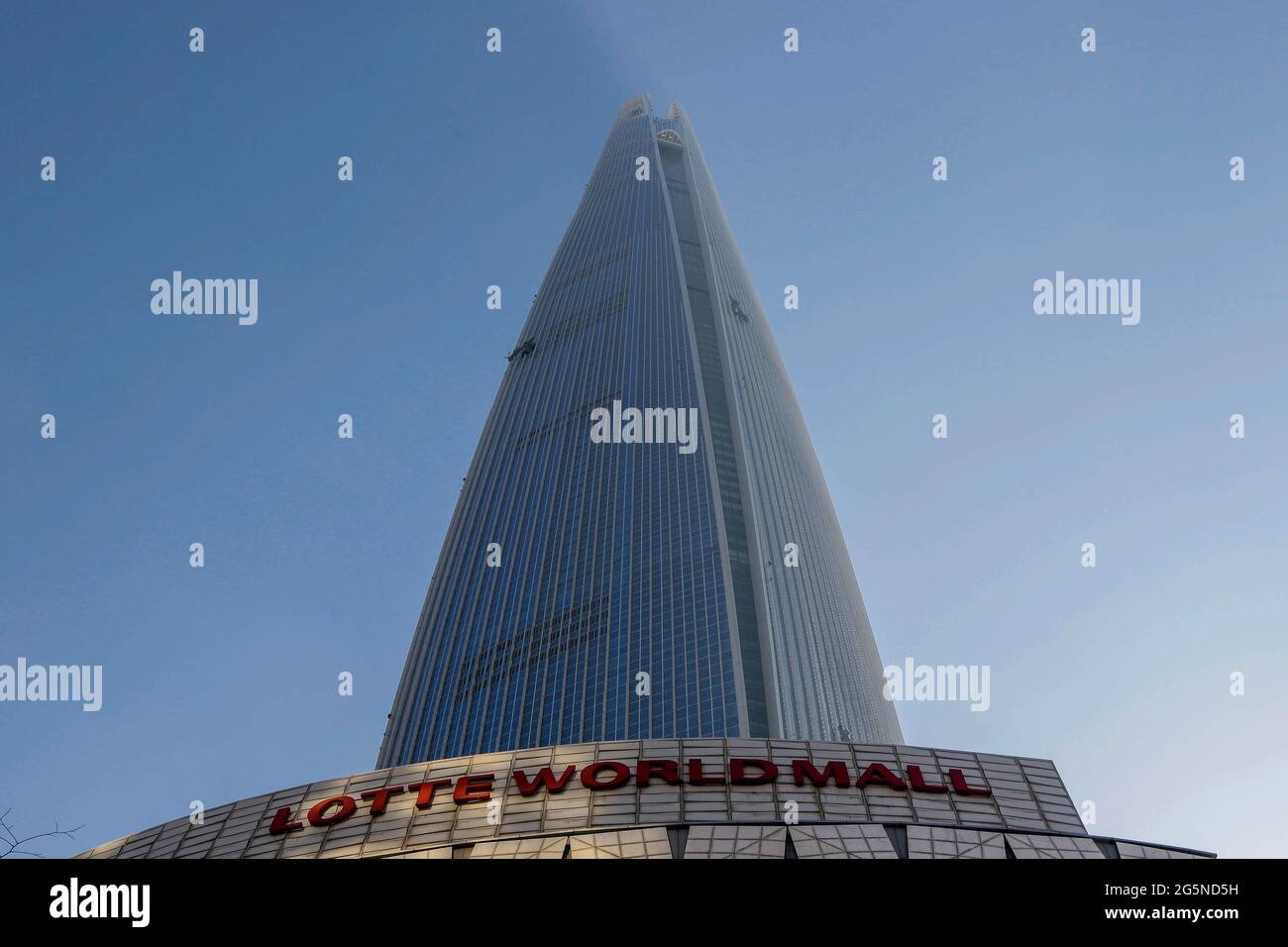 Daylight scene of Lotte World Tower, view from ground. Lotte World Tower is a 123-floor, 554.5-metre (1,819 ft) supertall skyscraper that finished external construction on March 17, 2016. The building's final 123rd floor was topped out on December 22, 2015. It is currently the tallest building in the OECD, and is the 5th tallest building in the world. Stock Photo
