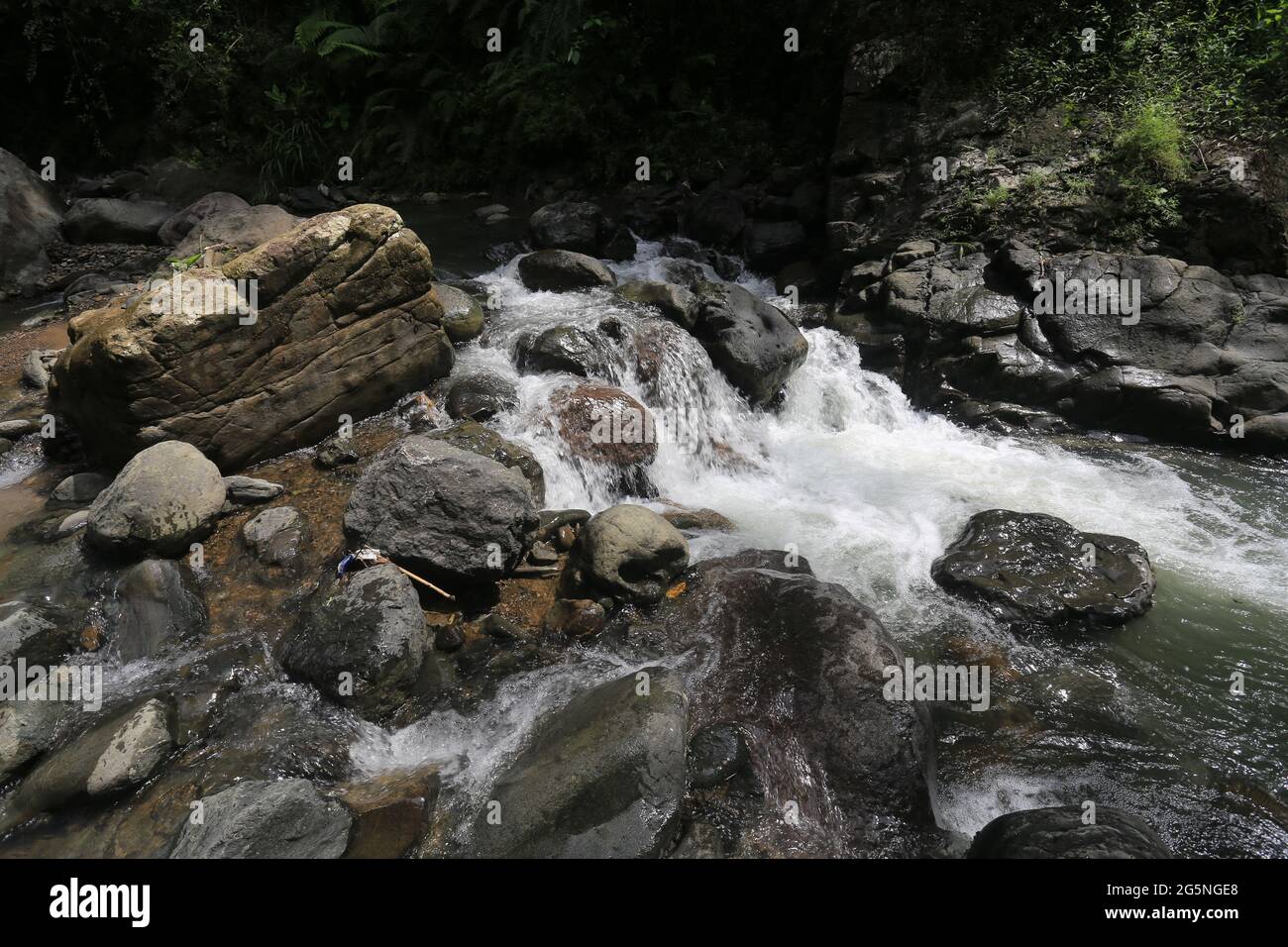 River and water falls runs on sediment rocks at West Java Indonesia ...