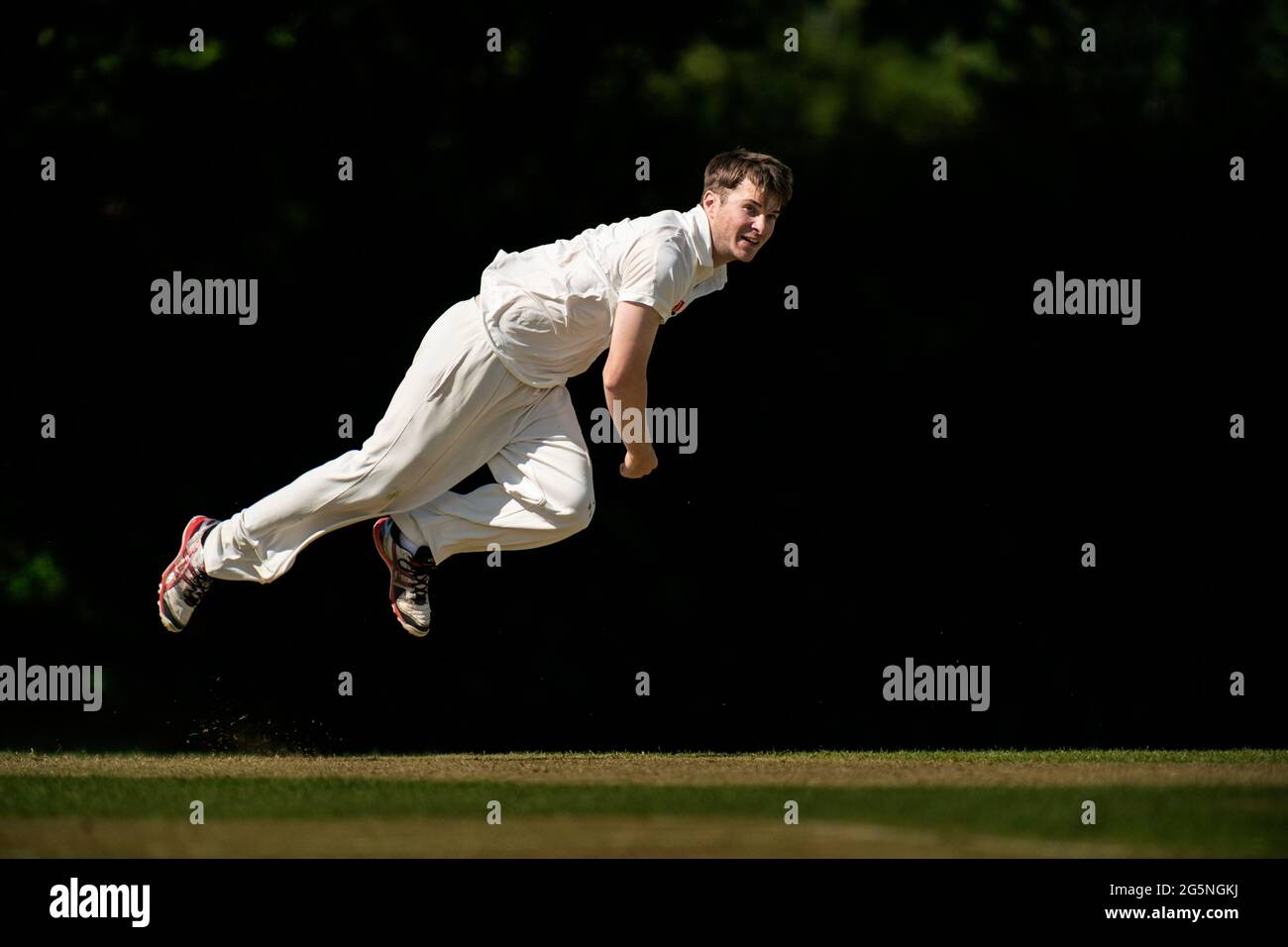 Fast bowler in action. Stock Photo