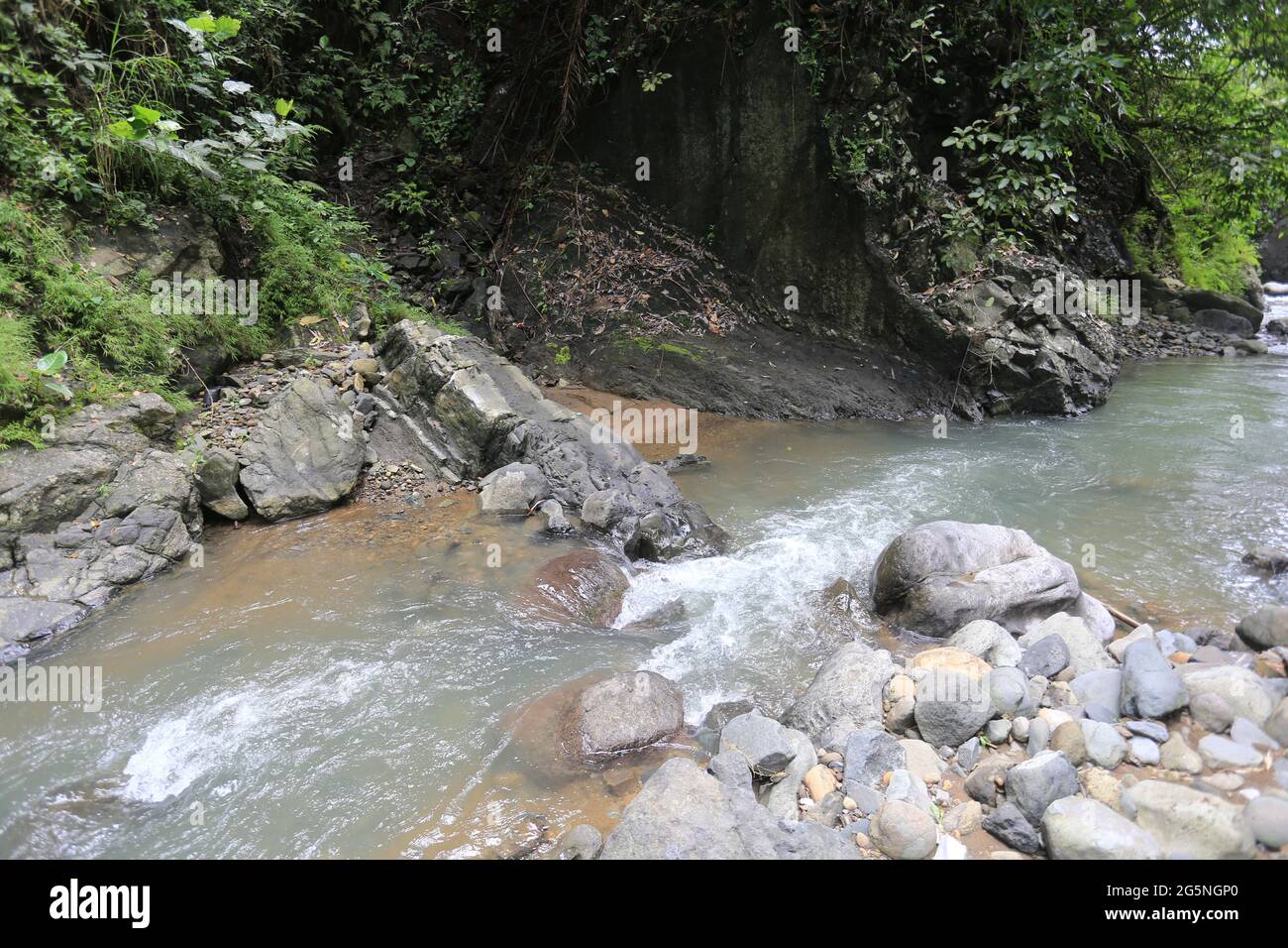 River and water falls runs on sediment rocks at West Java Indonesia ...